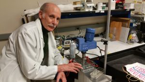 Richard Rome, MD, working with his machine which creates polymer fiber “muscles.”   (photo credit: Richard Rome)