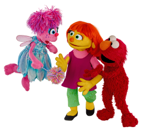 Julia with her friends Elmo and Abby Cadabby. © 2017 Sesame Workshop.  All Rights Reserved.  Photo Credit: Zach Hyman.