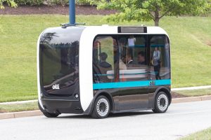 Olli is a rectangular shuttle with rounded edges, designed to look friendly. Photo Credit: Local Motors